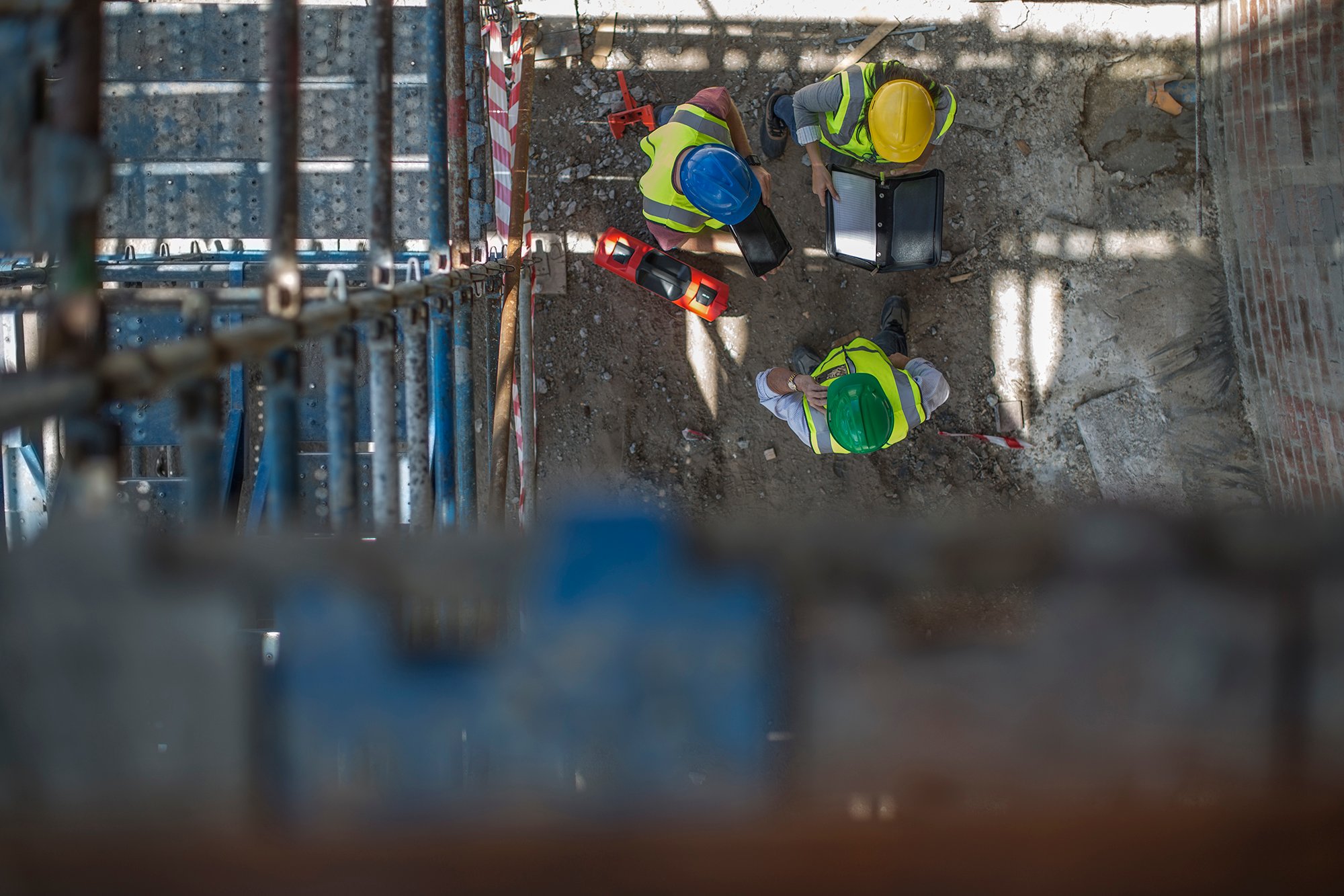 Achieving Avetta® compliance - contractors on a job site practicing safety protocols