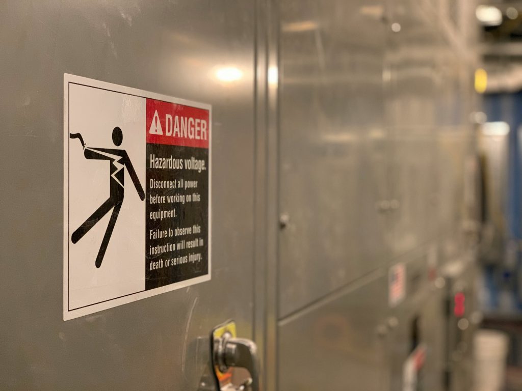 An electrical panel with a danger sign to ensure precaution for workers and bystanders